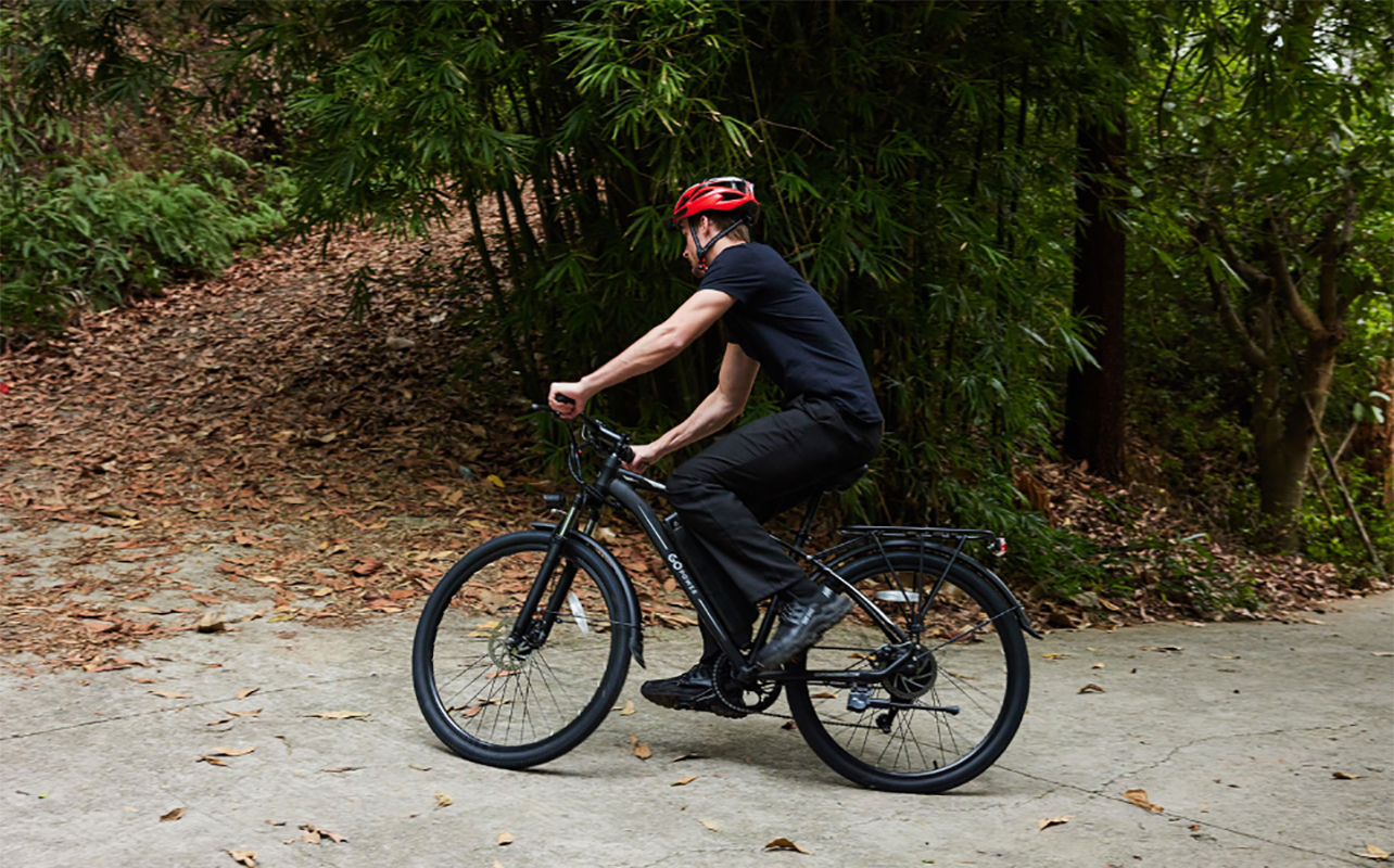 A man scaling a corner on a GoPowerBike e-bike.