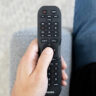 A Philips universal remote in hand.