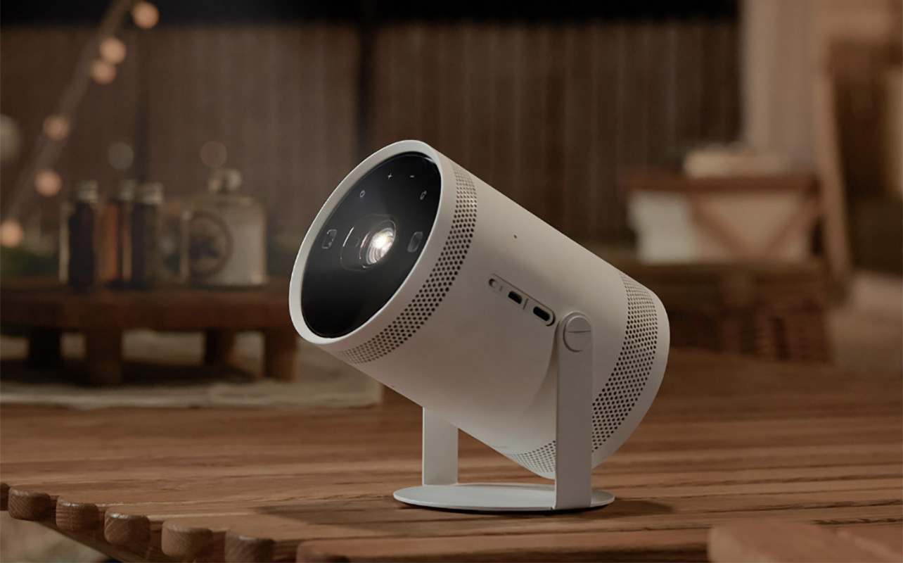 A Samsung The Freestyle portable projector on a table.