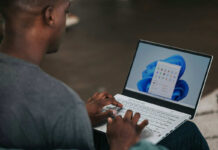 Man using Windows 11 on a laptop.