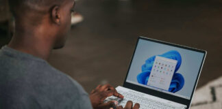 Man using Windows 11 on a laptop.