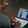 Man using Windows 11 on a laptop.