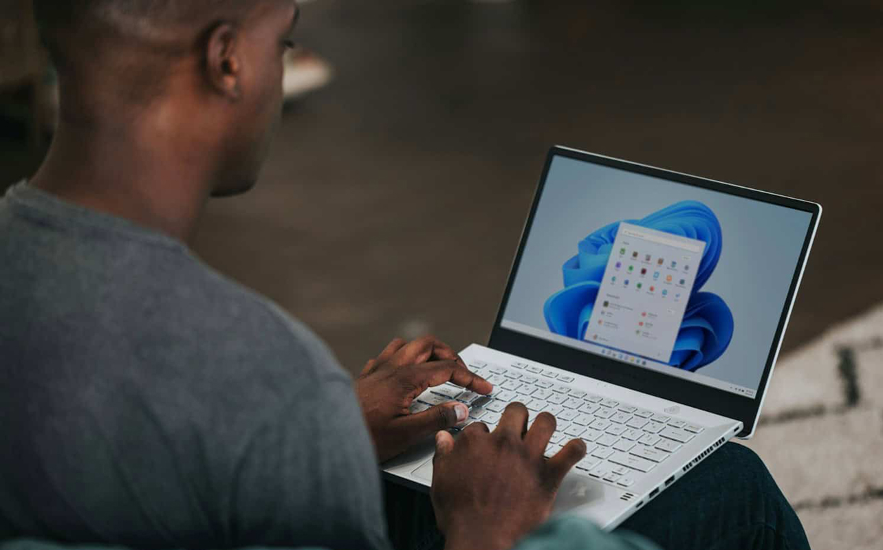 Man using Windows 11 on a laptop.
