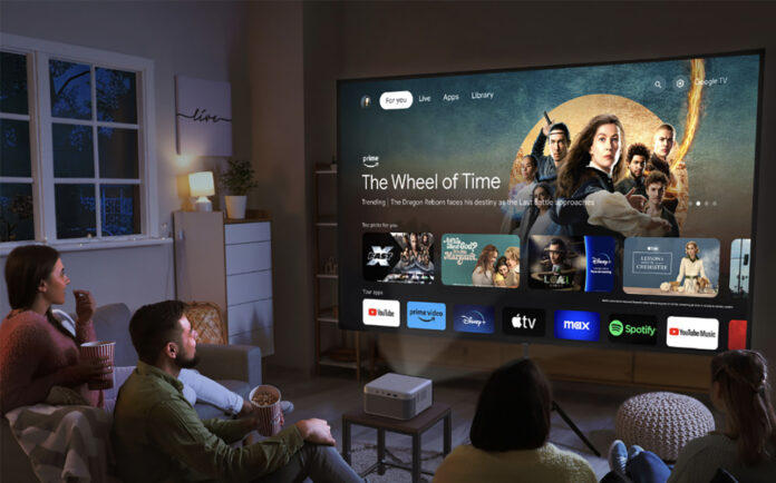 People sitting in a living room looking at a smart TV menu from an Epson Epiqvision Mini EF21 projector