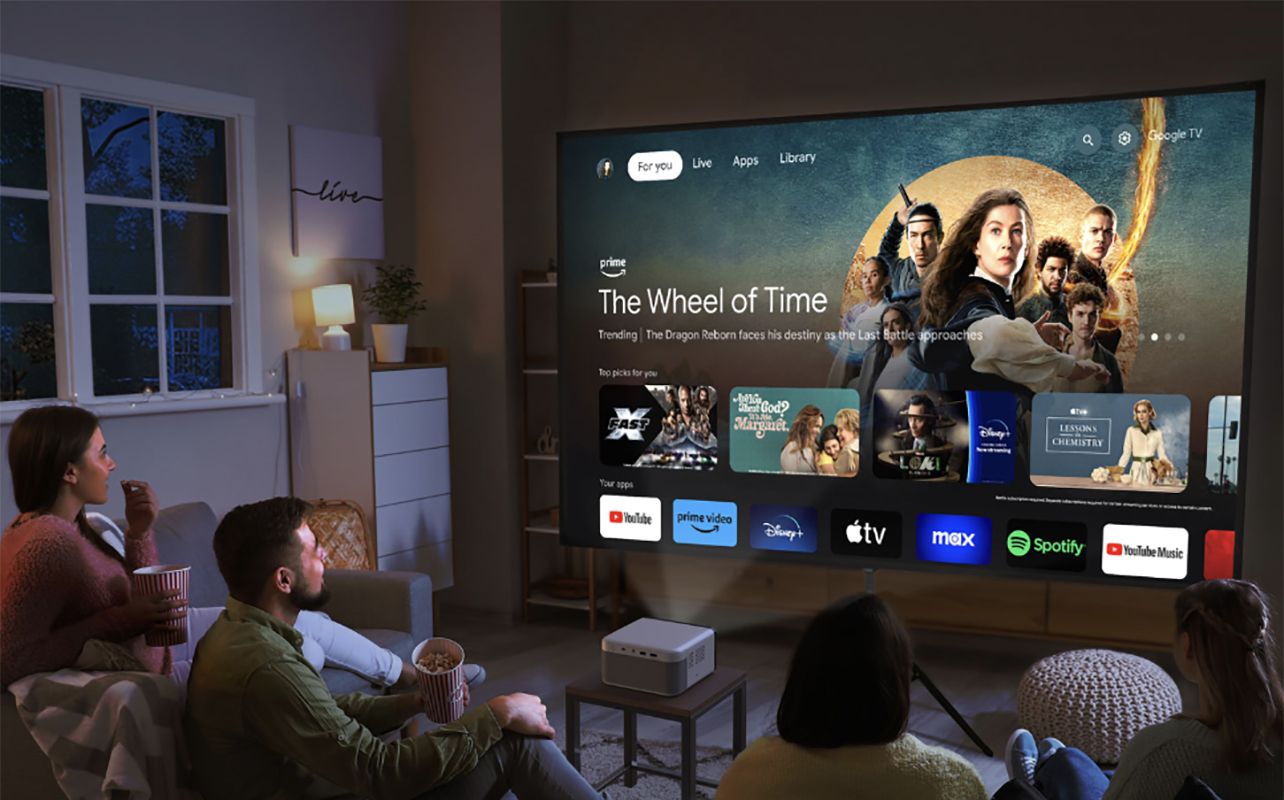 People sitting in a living room looking at a smart TV menu from an Epson Epiqvision Mini EF21 projector