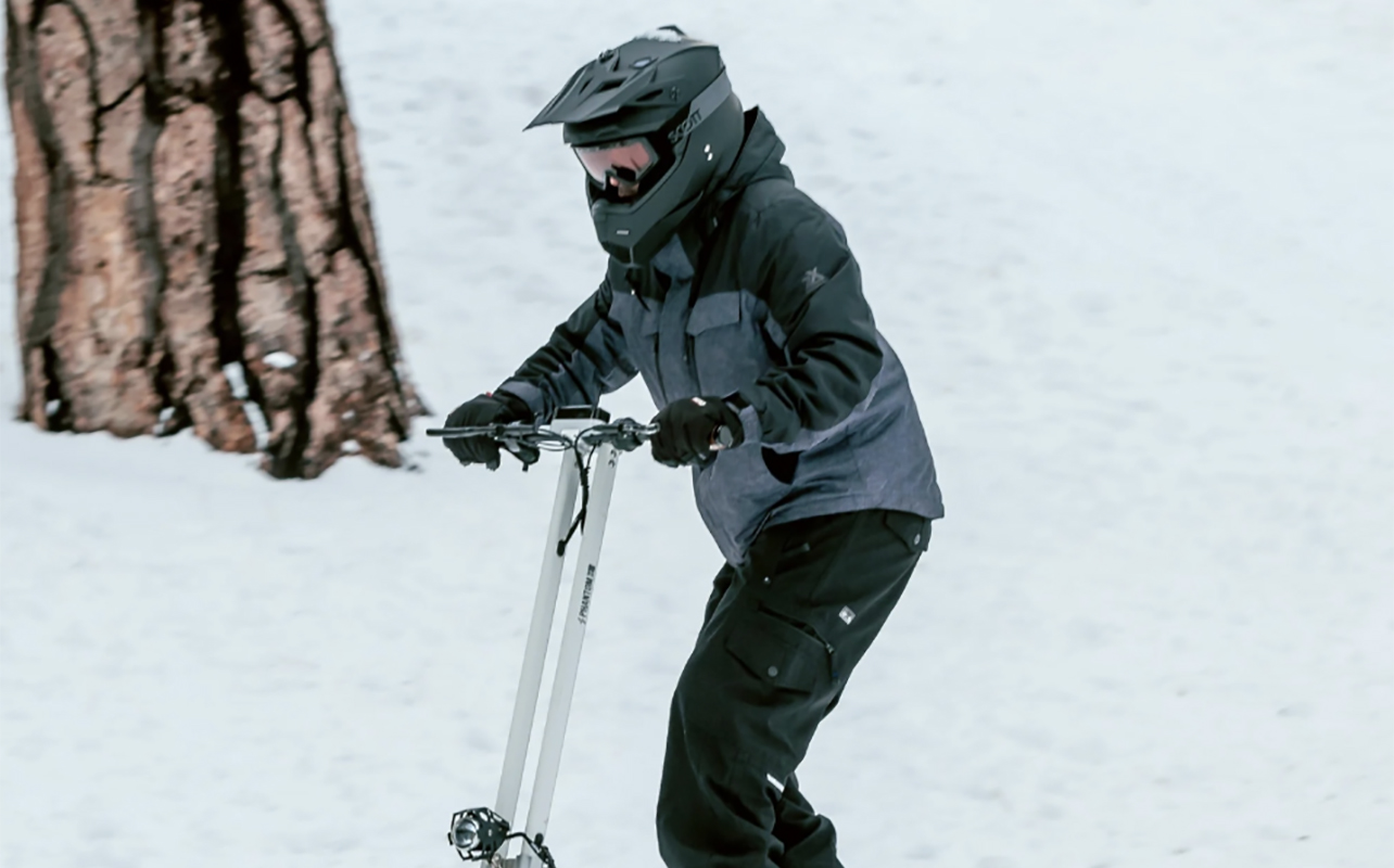 A man on a Phantom Gogo electric scooter