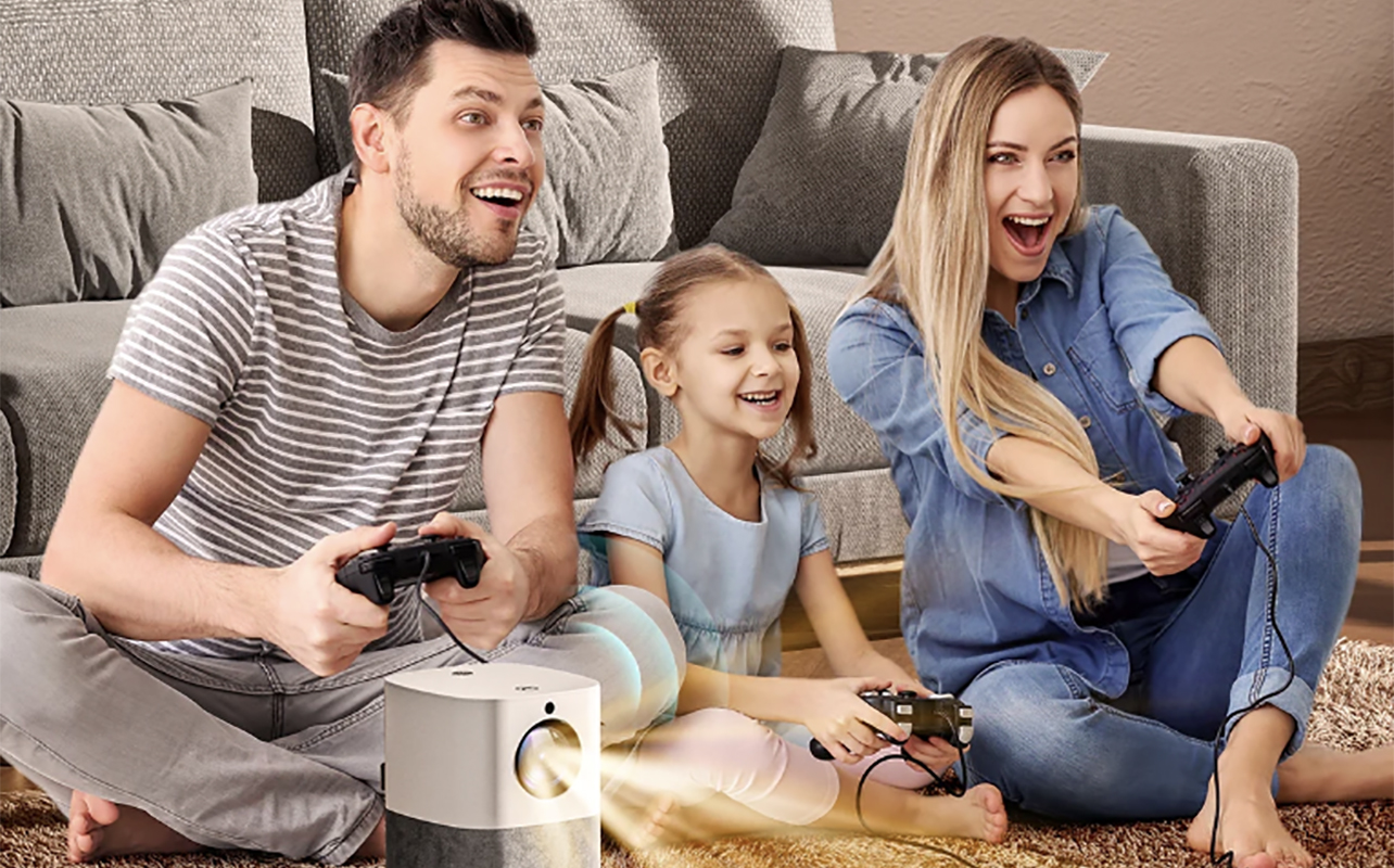 Une famille jouant à des jeux sur un projecteur x3 de Vankyo.
