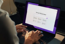 Man using an AI laptop waiting for a prompt.