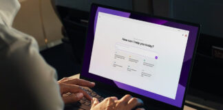 Man using an AI laptop waiting for a prompt.