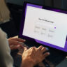 Man using an AI laptop waiting for a prompt.
