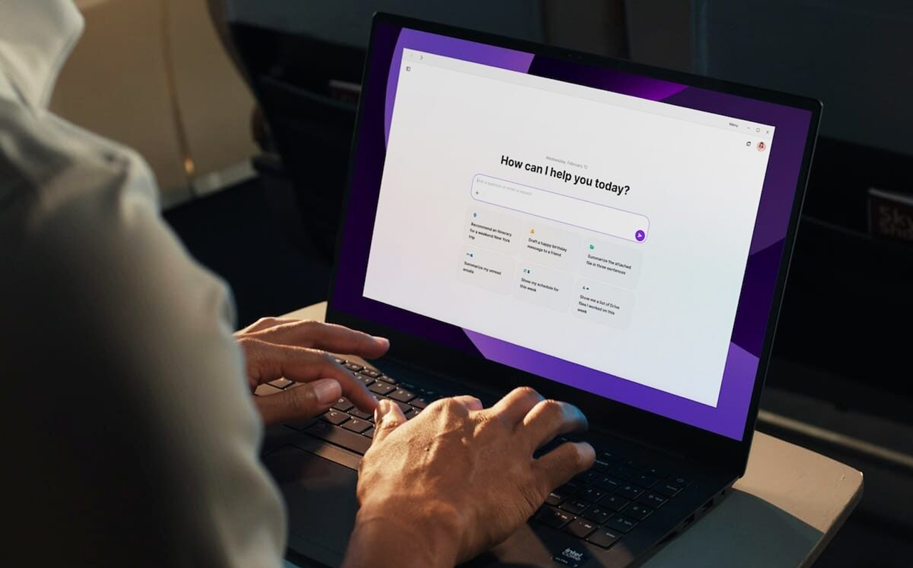 Man using an AI laptop waiting for a prompt.