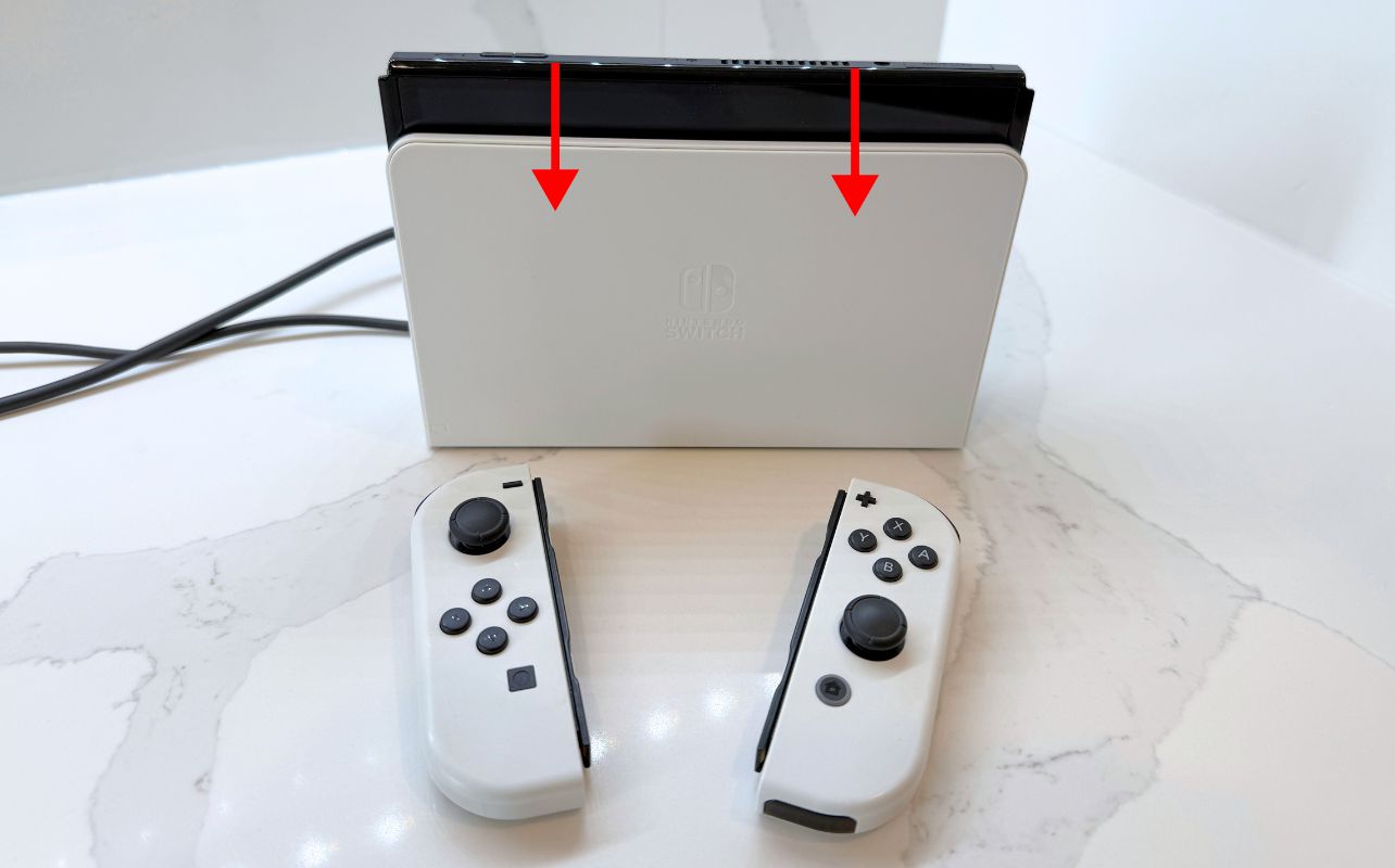The Nintendo Switch console docked fully.
