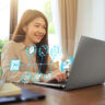 Woman using AI laptop with graphics showing what's possible.