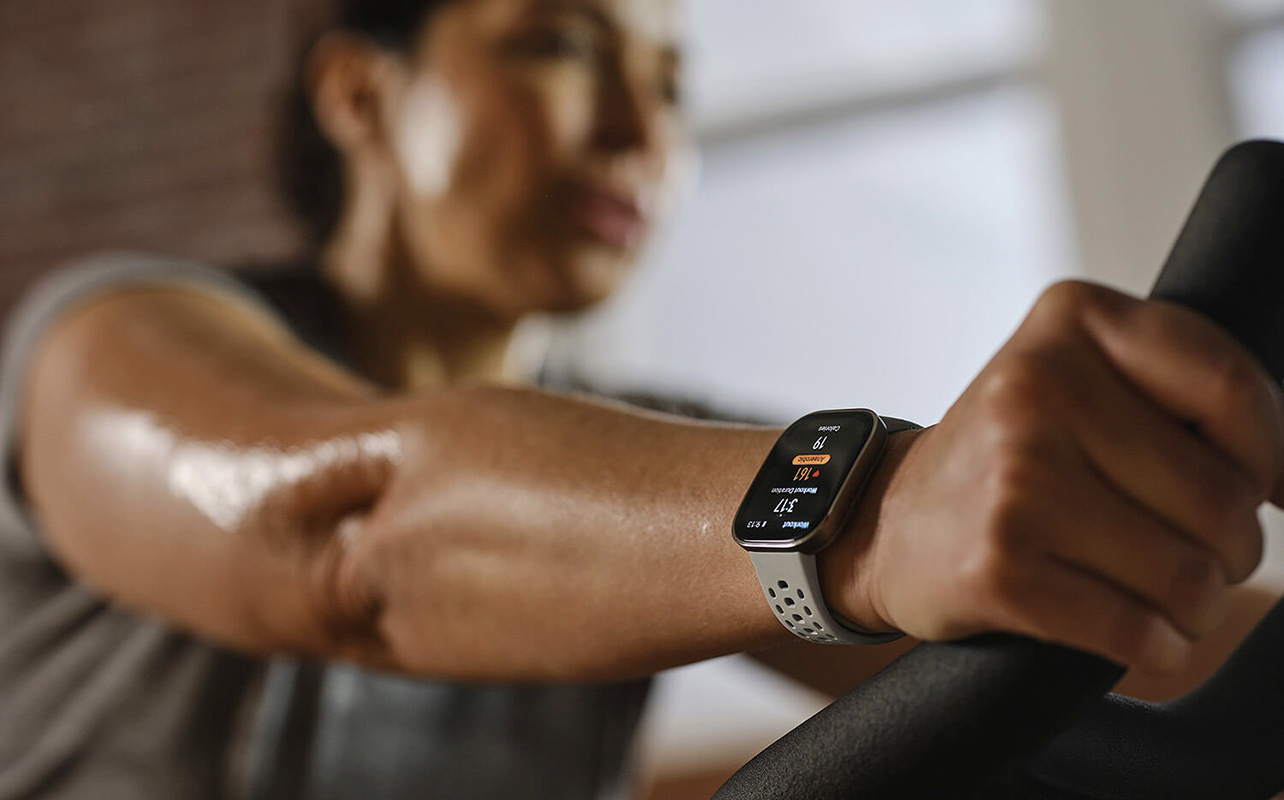 A woman on a treadmill wearing the Amazfit Bip 6