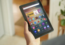 A hand holding an Amazon Fire tablet