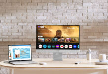 Asus Zenscreen smart monitor on a desk with other devices.