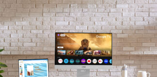 Asus Zenscreen smart monitor on a desk with other devices.