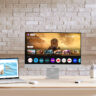 Asus Zenscreen smart monitor on a desk with other devices.