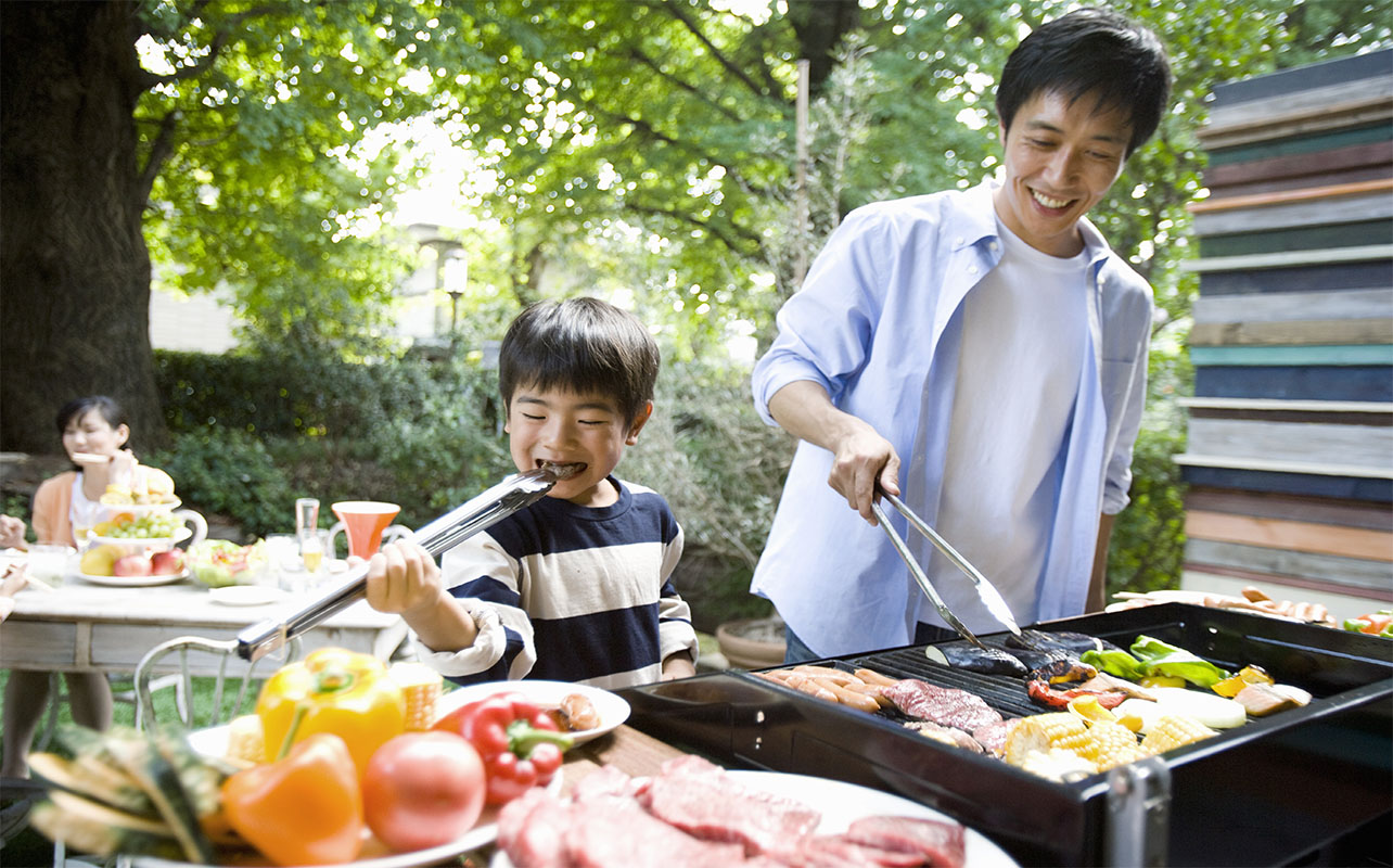 father's day gift ideas - father and son grilling at a BBQ