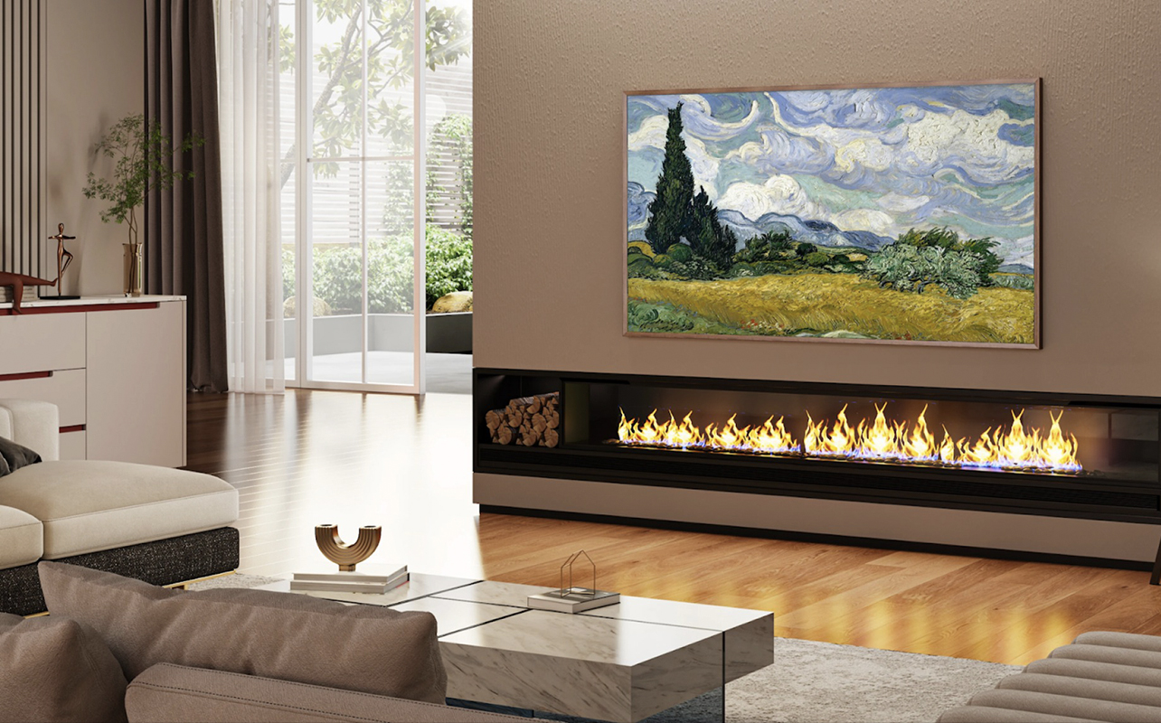 The Hisense Canvas TV mounted on a wall under a fireplace.