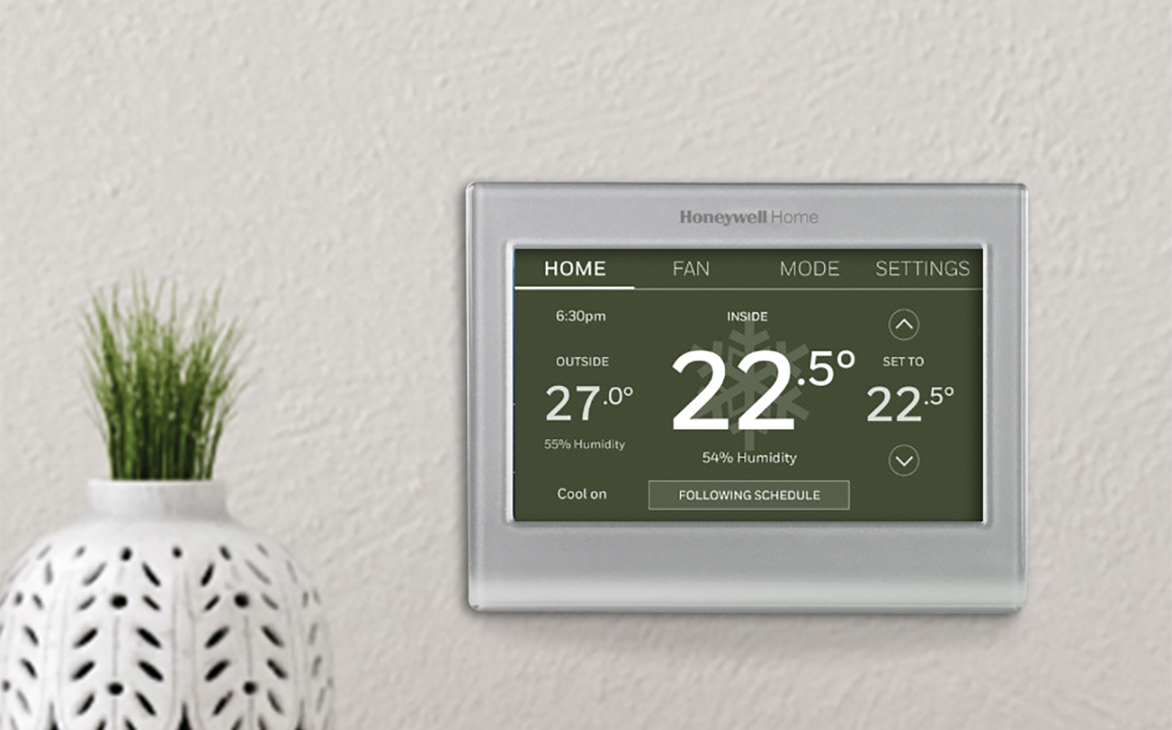 A Honeywell WiFi smart thermostat on the wall.