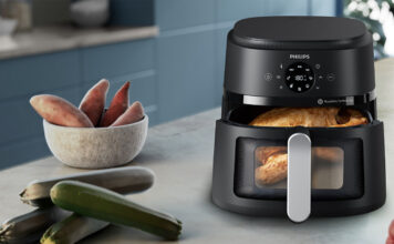 Philips 2000 Series air fryer with chicken, potatoes, and vegetables.