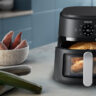 Philips 2000 Series air fryer with chicken, potatoes, and vegetables.