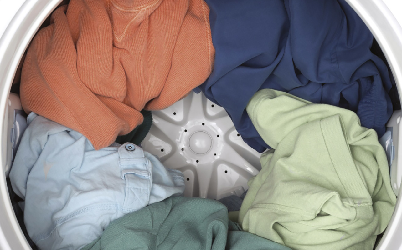 A close-uo of clothing inside a GE washer.