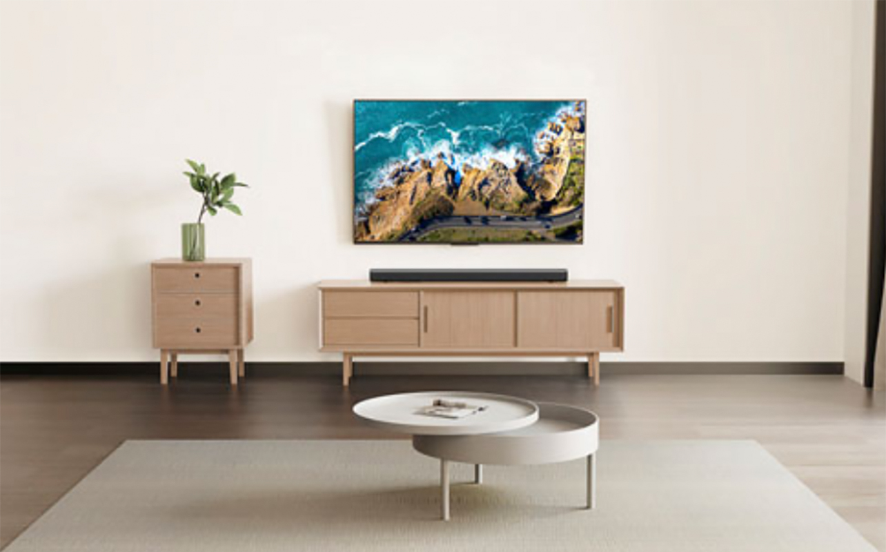 A living room with the JBL Cinema SB510 sound bar and TV.