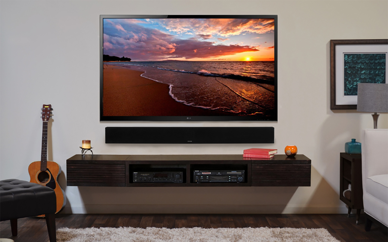 A TV with a Monitor Audio SB4 sound bar underneath.
