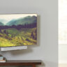 A TV mounted with a Sonos Beam soundbar underneath, mounted on a Sanus mount.