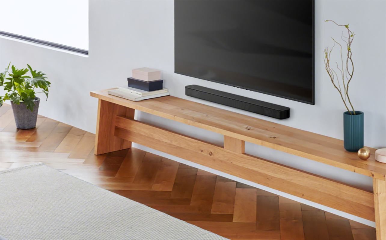 A side view of a TV with the Sony HTS100F sound bar underneath.