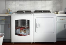A Whirlpool washer and dryer with clothing in the washer.