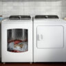 A Whirlpool washer and dryer with clothing in the washer.