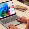 Woman using Copilot+on an HP laptop.
