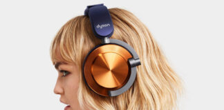 Blonde woman wearing Dyson OnTrac headphones in nickel and purple.