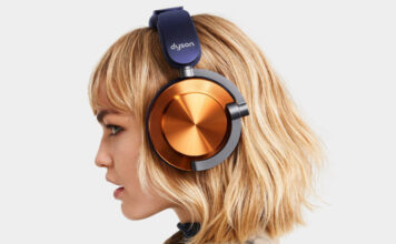 Blonde woman wearing Dyson OnTrac headphones in nickel and purple.