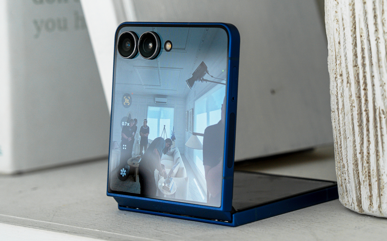 Samsung Galaxy Z Flip7 sitting on shelf with camera app in live view.