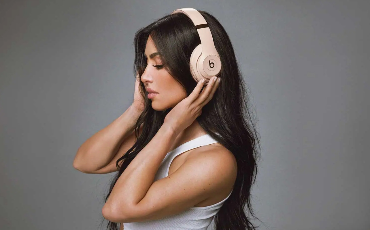 Kim Kardashian wearing Beats Studio Pro headphones.