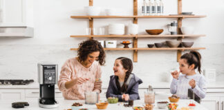 mother and two daughters having fun, making ice cream together with a Ninja ice cream maker.