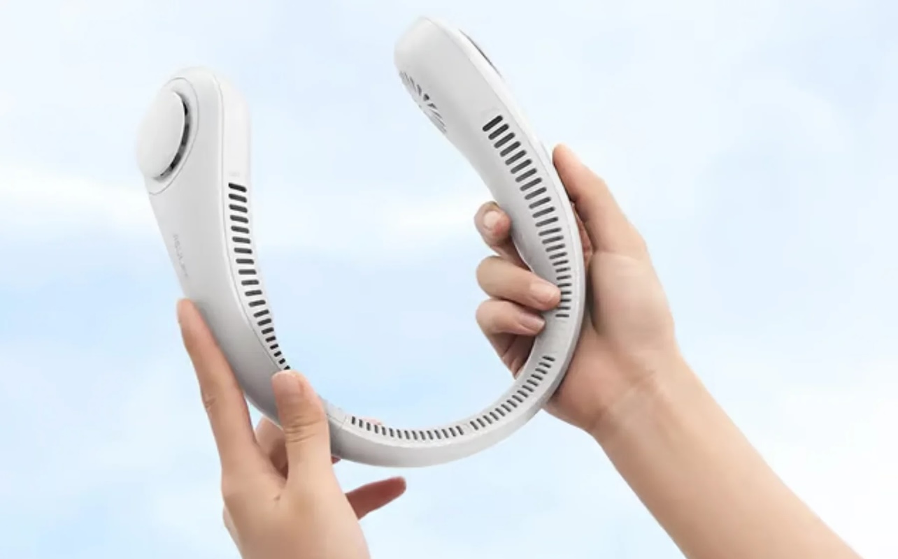 Hands hold a neck fan