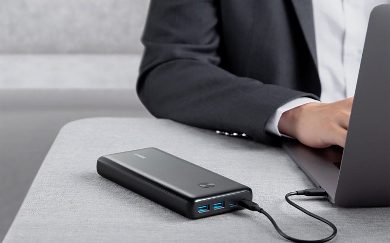 A close up of the Anker Powercore III Elite charging a laptop