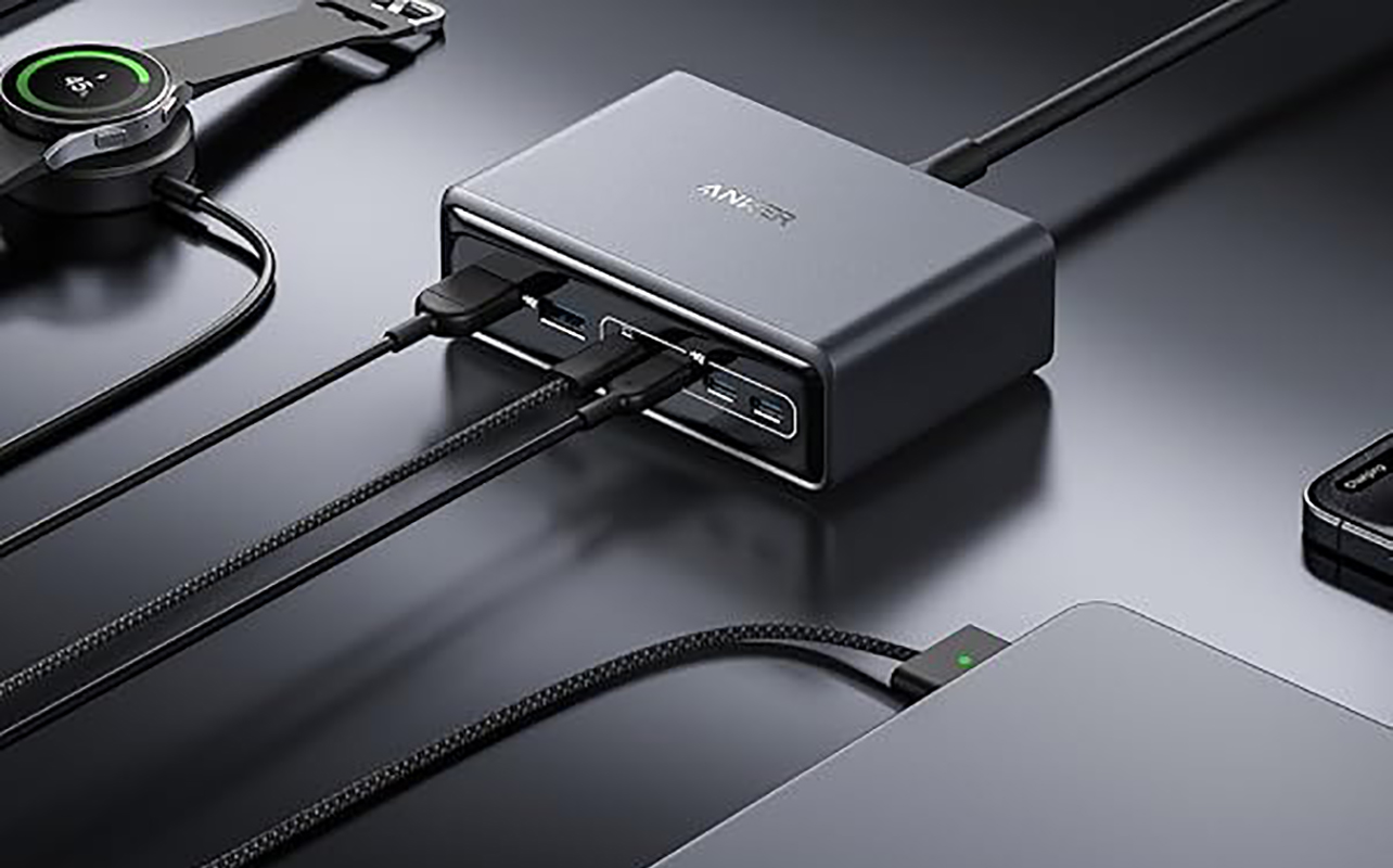 The Anker Prime Charger 200W with various devices plugged into it.