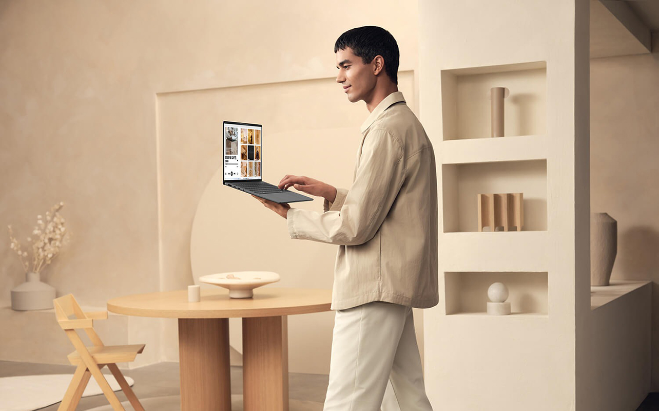 A man walking around with the Asus Zenbook A14