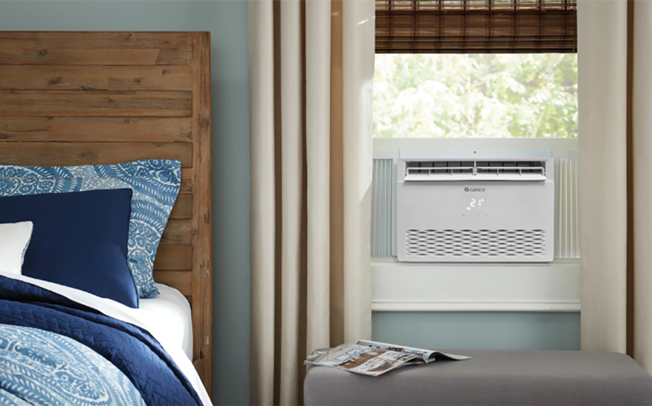 A Gree Chalet window air conditioner in a bedroom - Leaking Air Conditioner