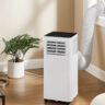 An Insignia portable air conditioner by the window in a living room.