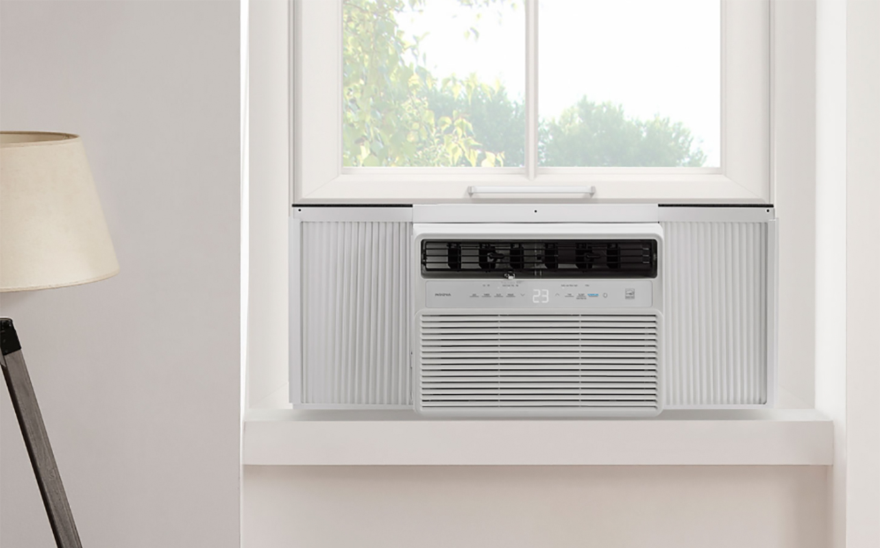 An Insignia window air conditioner mounted on the window - Leaking Air Conditioner