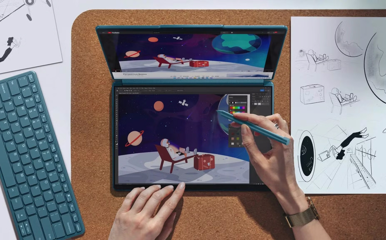 Quelqu'un qui utilise le Yoga Book 2-en-1 de Lenovo pour créer des œuvres d'art.