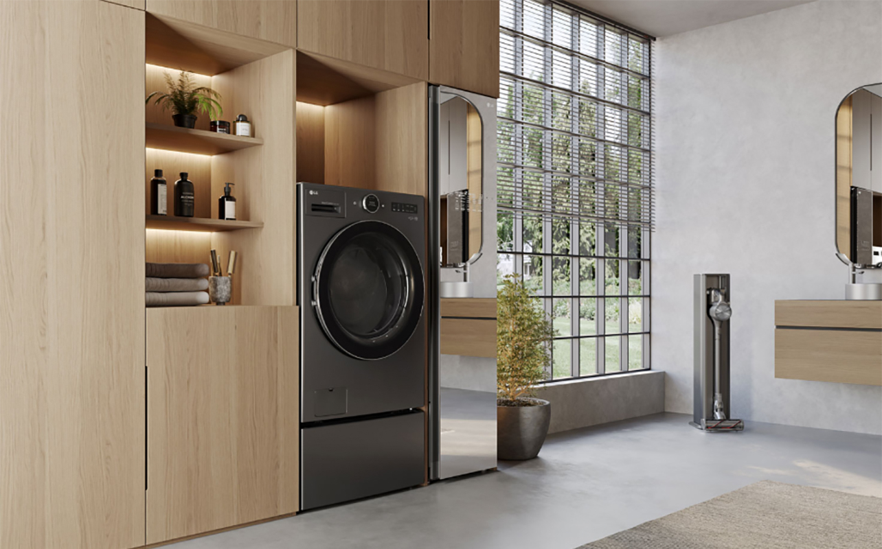 A side view of an LG washer dryer combo unit sitting flush within furniture.