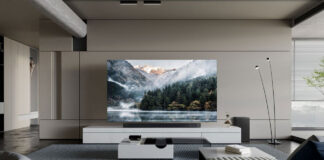 A Samsung Neo QLED TV on furniture in a room.